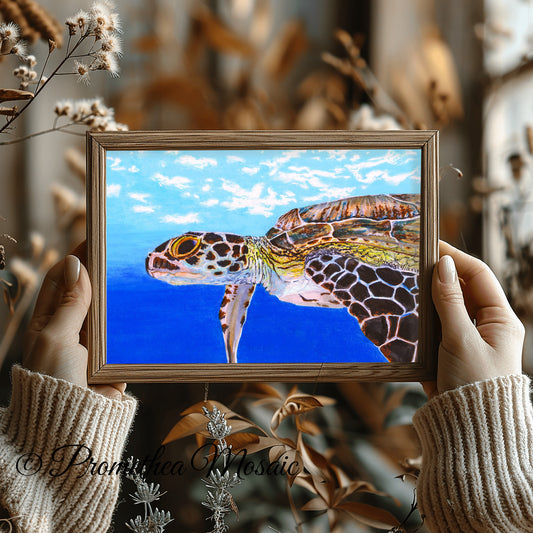 Framed sea turtle art print, held by hands with autumn leaves in background, eco friendly ocean wall decor illustration created in alcohol marker.