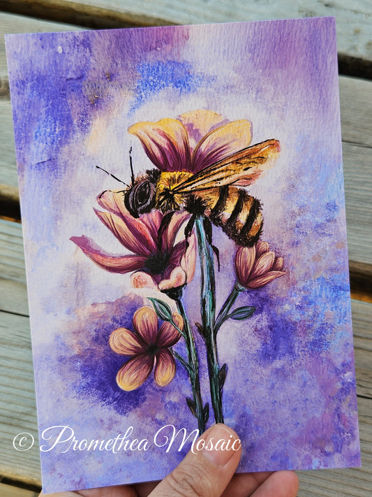 Artistic depiction of a bee on flowers with a watercolor background, held by a hand.