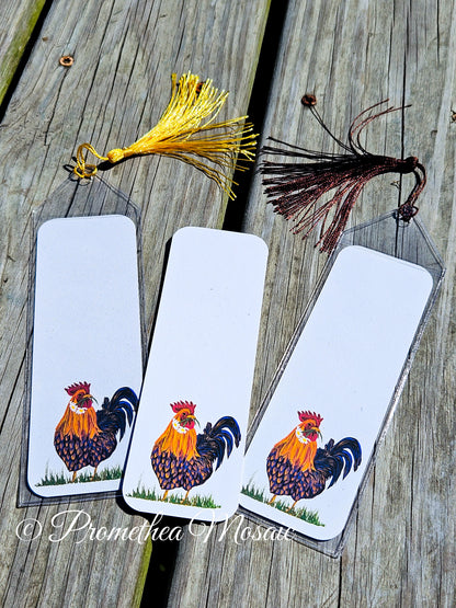Display of 'Love Rooster' bookmarks with center one showing how it looks with no sleeve or tassel