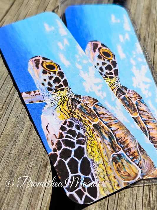 Detail painting like art of a sea turtle underwater on a bookmark.