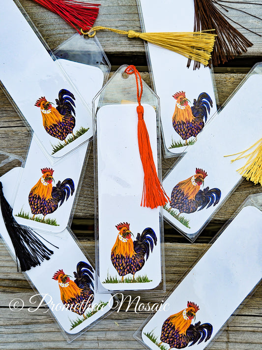Bookmarks with rooster designs and tassels on a wooden surface, featuring the brand 'Promethia Mosaic'.